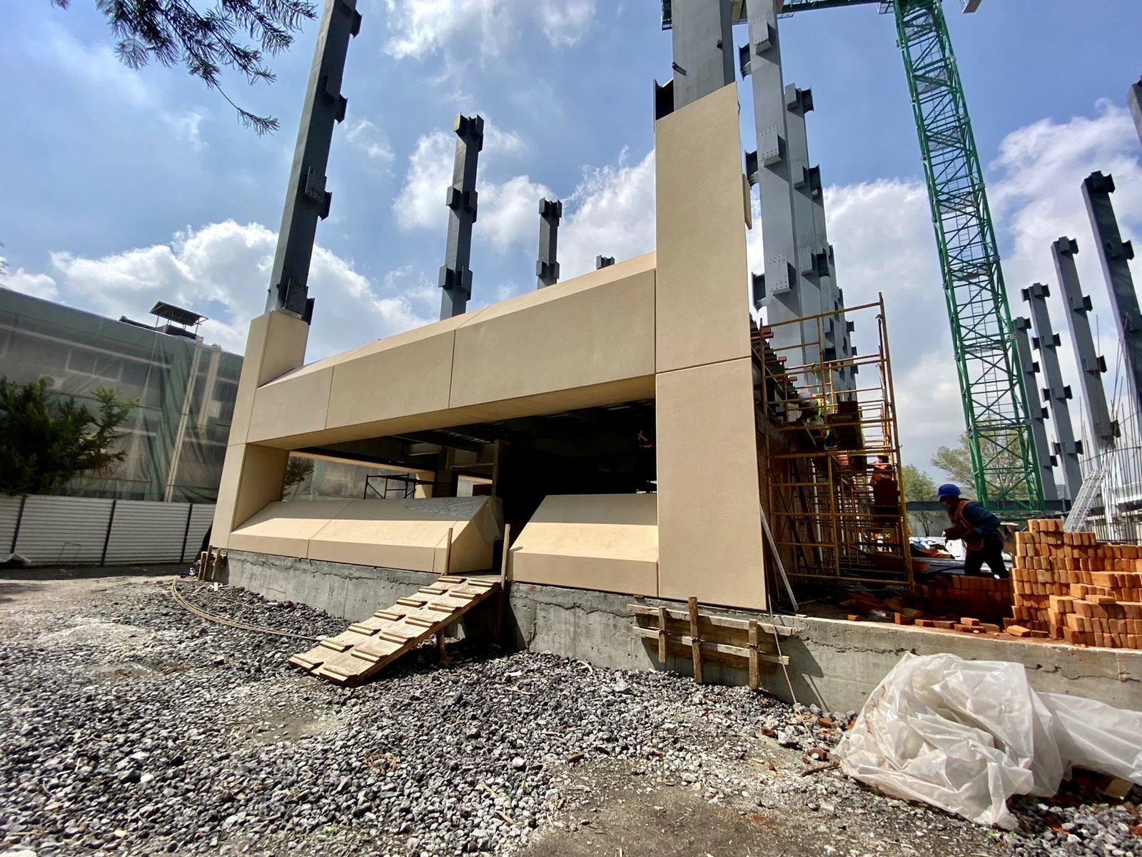 Precast components positioned in front of the building structure